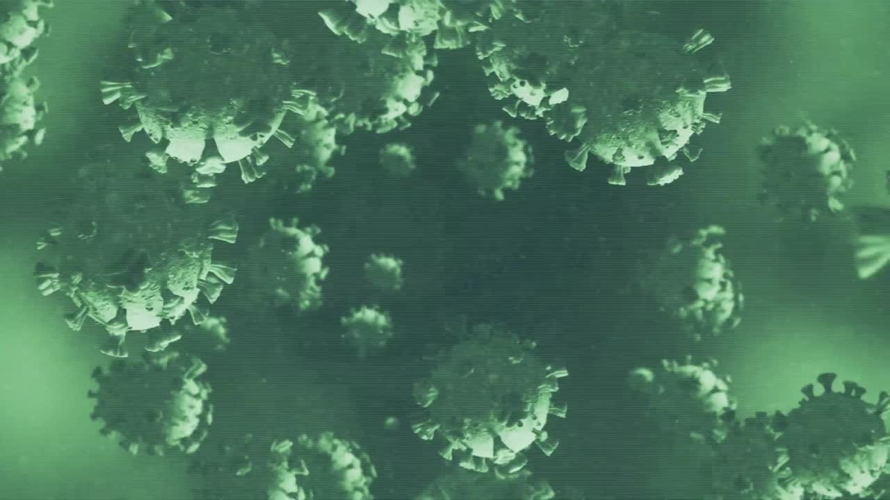 어두운 배경에 떨어지는 코로나19 세포의 애니메이션