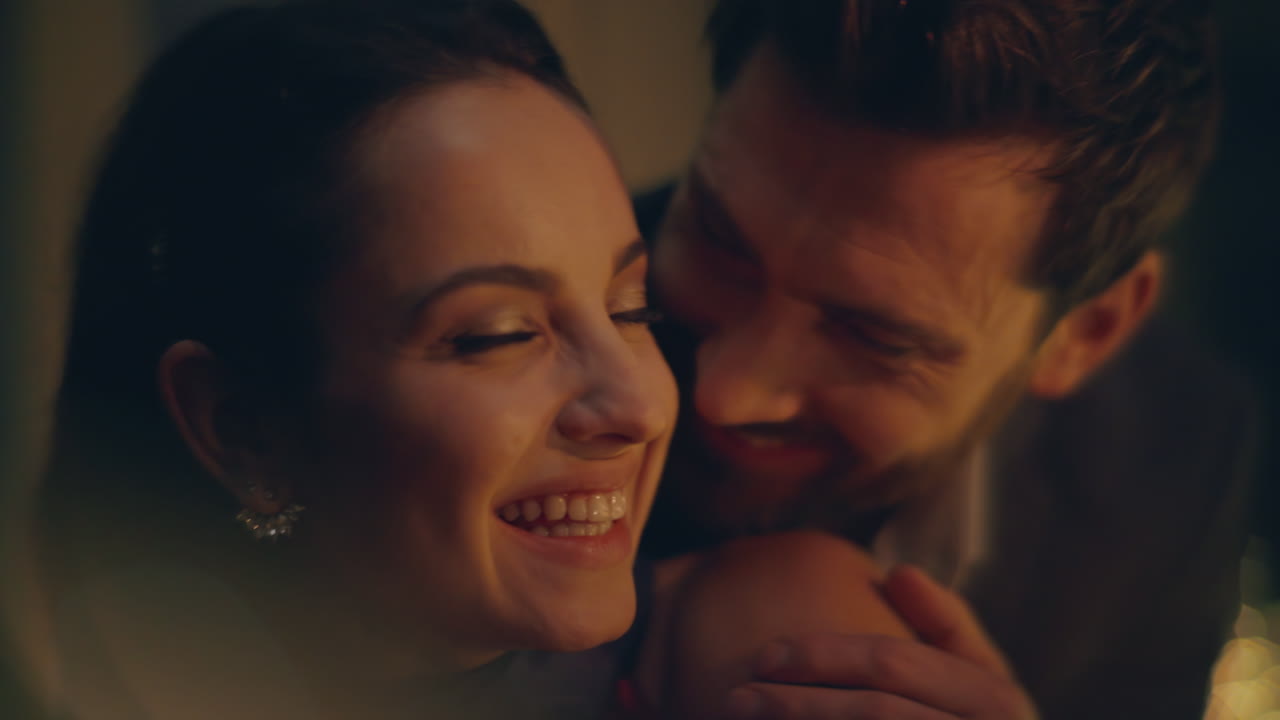 Closeup romantic spouses embracing together at night feeling closeness at hotel