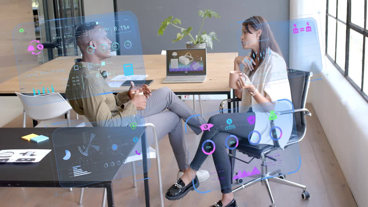 Colleagues sitting at business table, woman starting speaking and gesturing, HUD showing charts