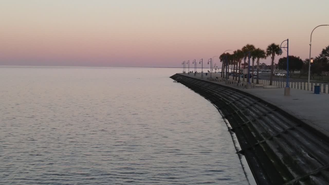 Calm Water Along Lakeshore Drive During Sunset In New Orleans, Louisiana USA. Aerial Drone