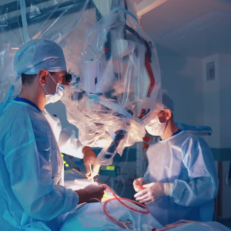 group of doctors perform an operation to a patient. surgeons in medical uniform and masks working in the operating room. neurosurgery.