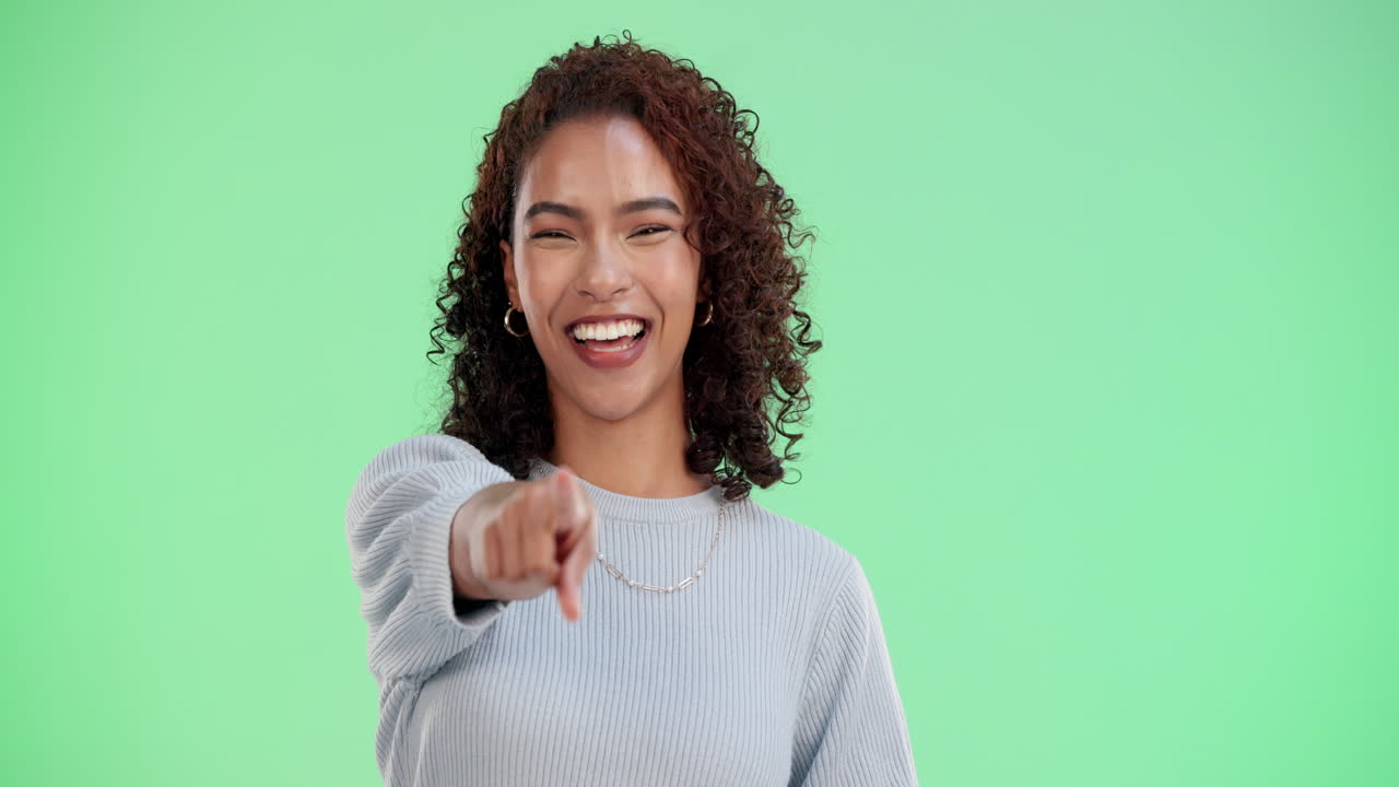 Smiling Woman Pointing at Camera