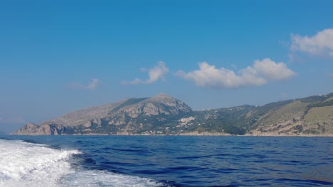 ferry traveling towards amalfi coast in italy - pov
