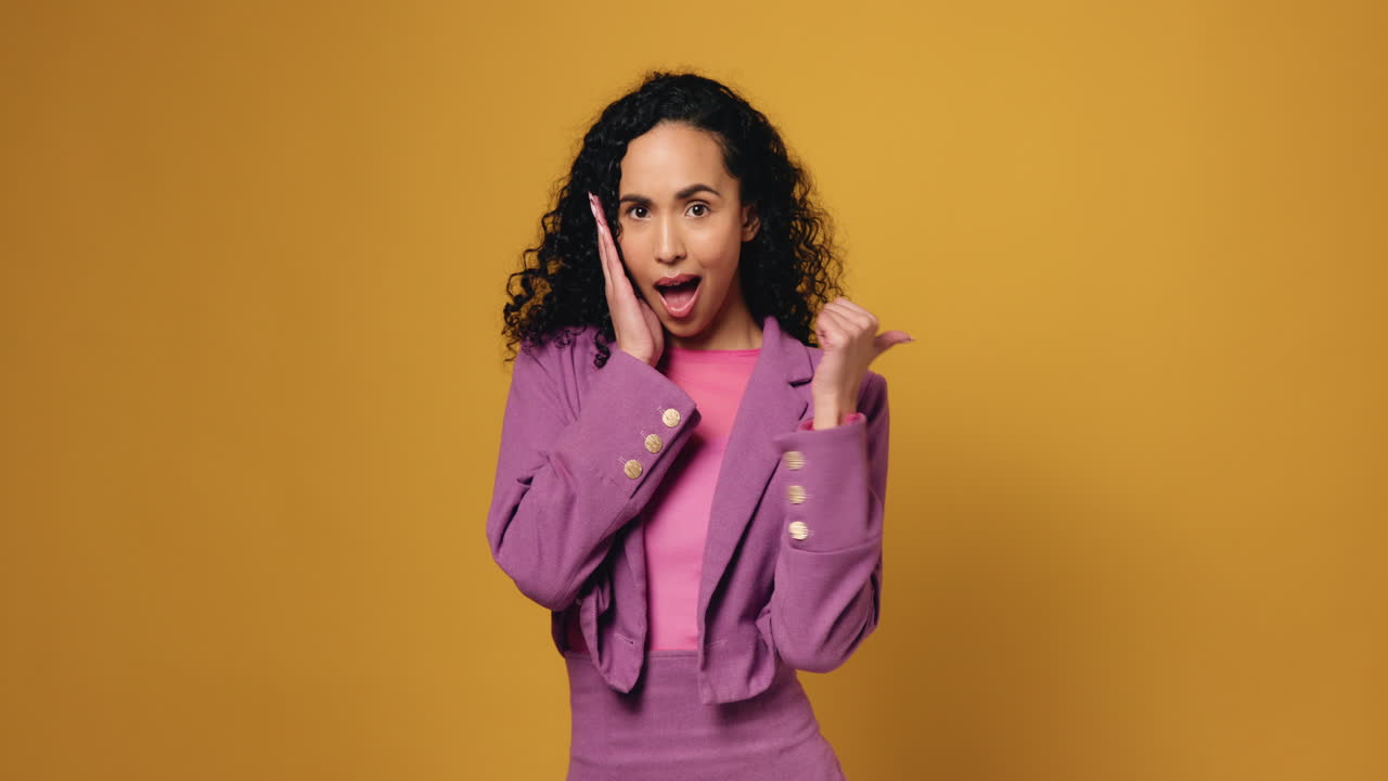 Woman in Purple Suit Expressing Surprise and Happiness