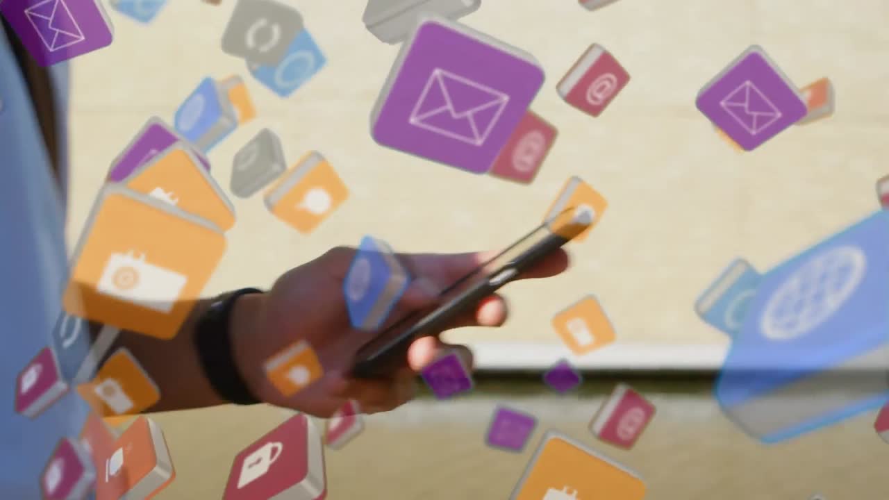 Businessman walking on a hall while texting