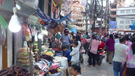 city center, kathmandu, nepal - a view of pedestrians and motorcyclists on the bustling street - medium shot