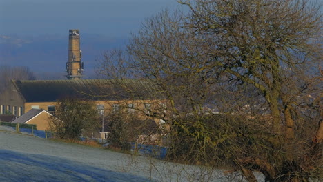 Rising-Establishing-Aerial-Drone-Shot-Over-Calverley-Village-with-Mill-on-Frosty-Winter-Morning-West-Yorkshire-UK