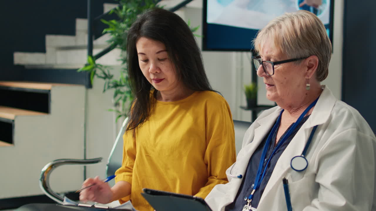 Doctor consulting with patient in clinic waiting room