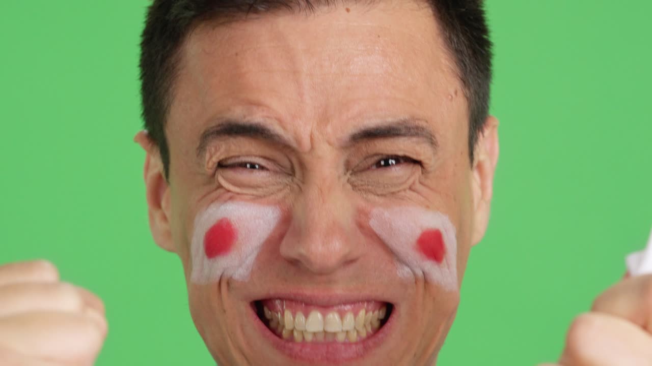 Close up of a man supporting japanese team