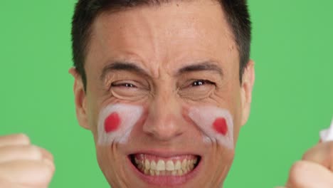 close up of a man supporting japanese team