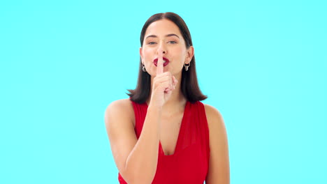 Finger,-lips-and-face-of-happy-woman-on-blue