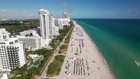 Reverse-drone-shot-along-beach