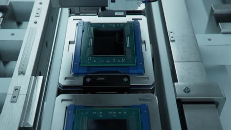 shot of advanced computer processor on production line is being tested at semiconductor factory. microchip production process.