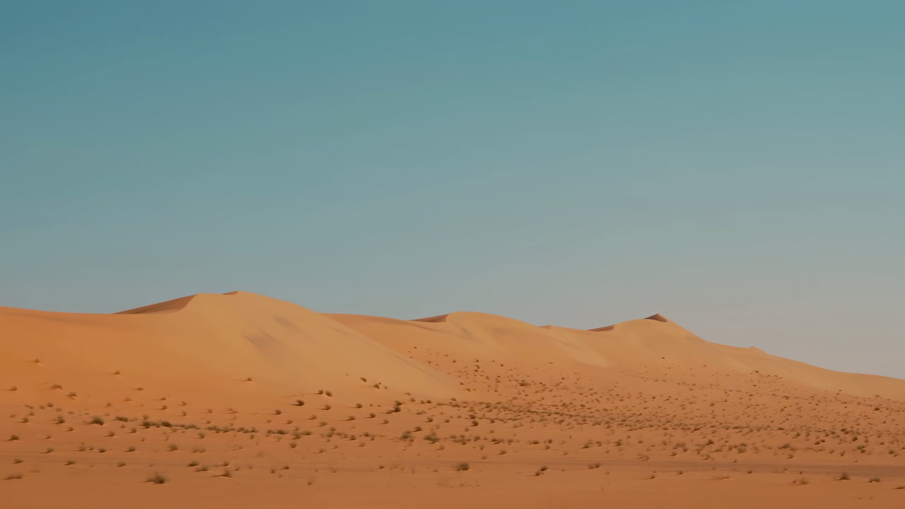 Minimal Desert Dunes Under Clear Sky With Distant Sand Ripples And Sparse Scrub, Warm Midday Light, Cinematic