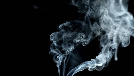 jet of smoke on black background.