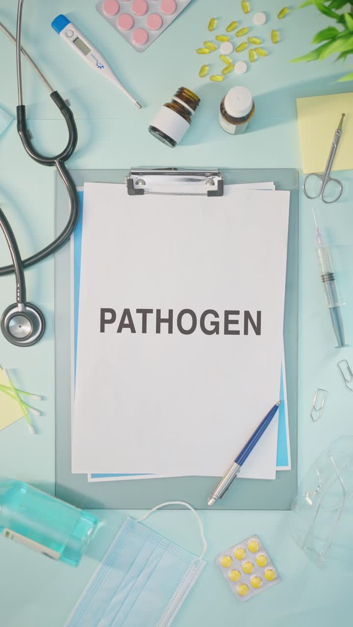 VERTICAL VIDEO OF PATHOGEN WRITTEN ON MEDICAL PAPER