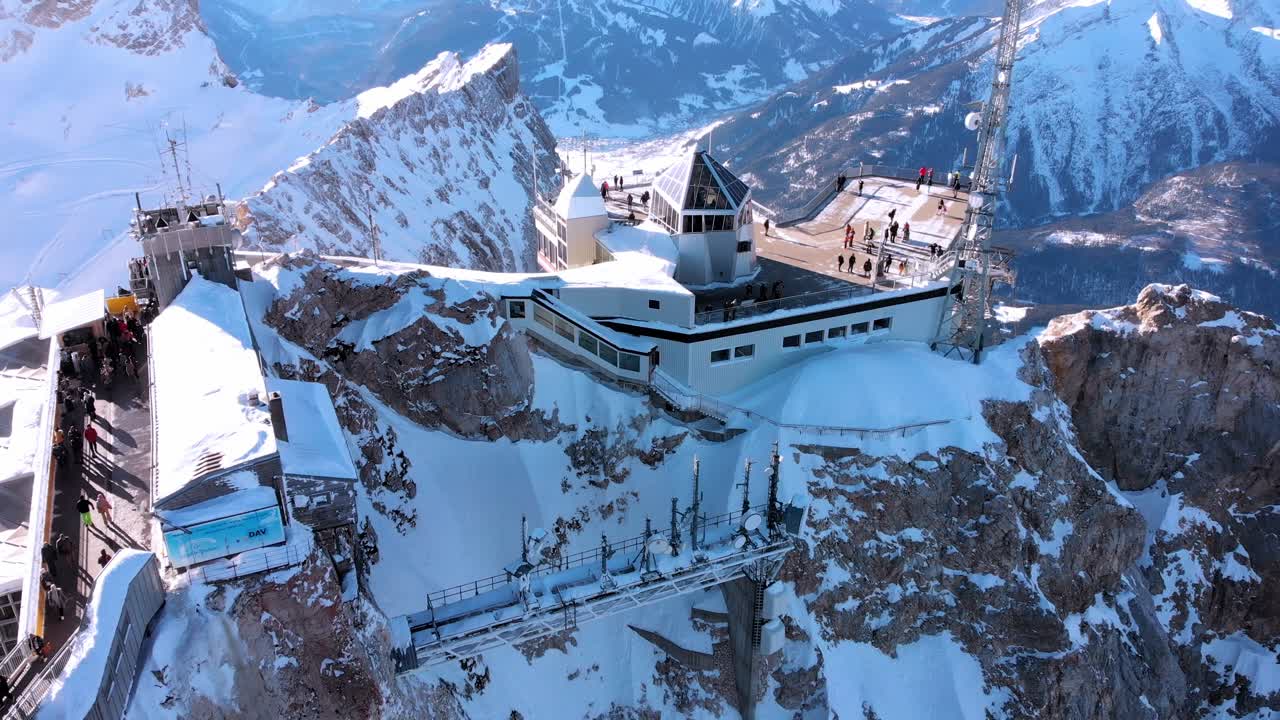 Aerial: drone flying by the mountain station close to the Zugspitze