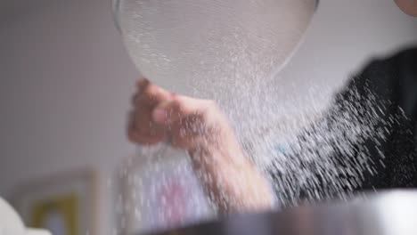 baker-sieves-flour-in-to-bowl-slow-mo