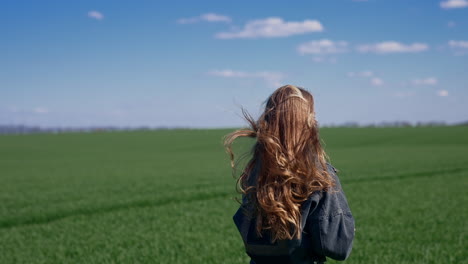 girl running through field. free girl running fun across the green field