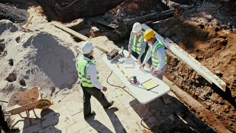 construction workers collaborating on a building project