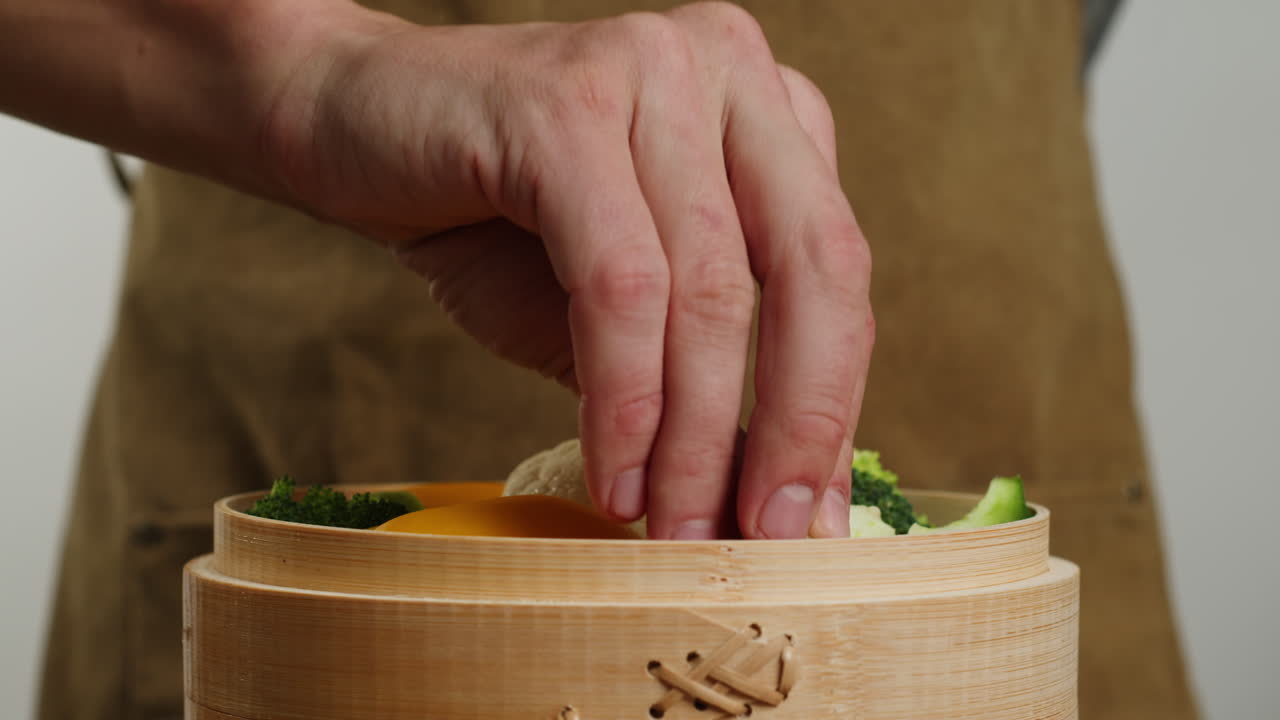 Preparing Steamed Vegetables in Bamboo Steamer