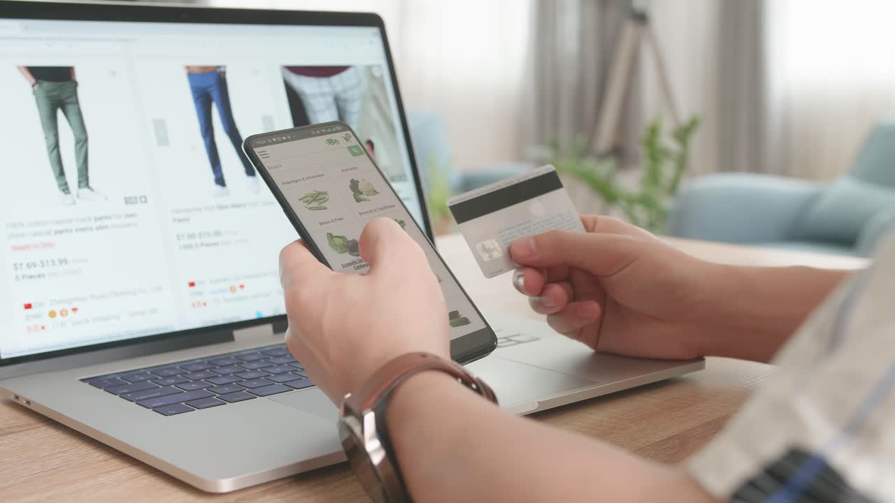Close Up Hand Man Holding Credit Card, Using Smartphone And Laptop Computer Order Vegetables And Clothes Online, Online Shopping