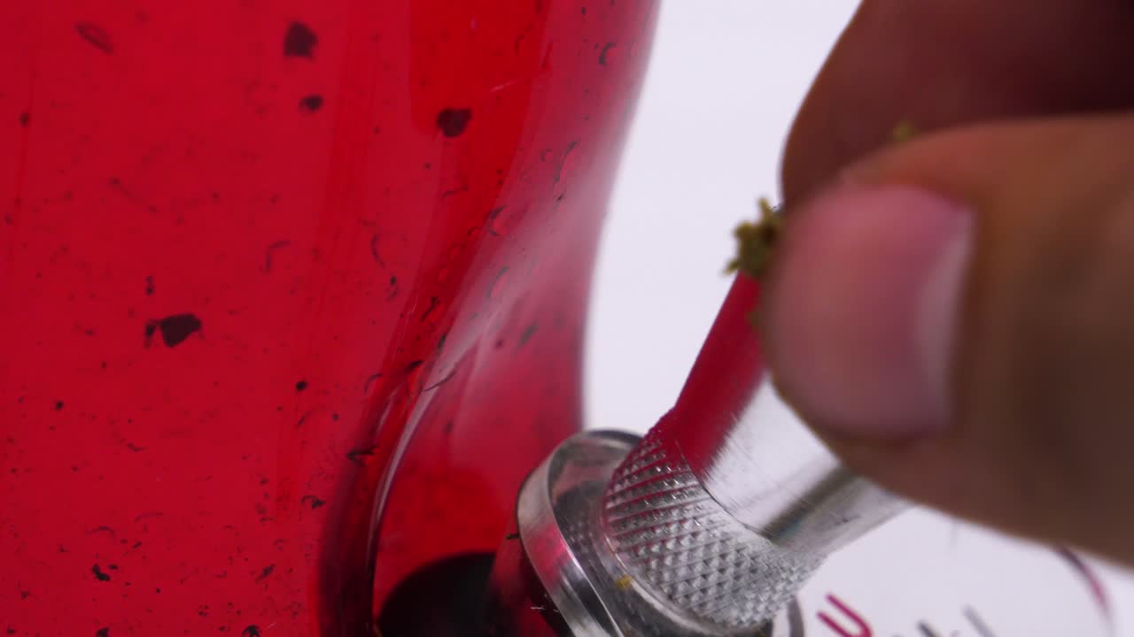 packing a bowl of weed