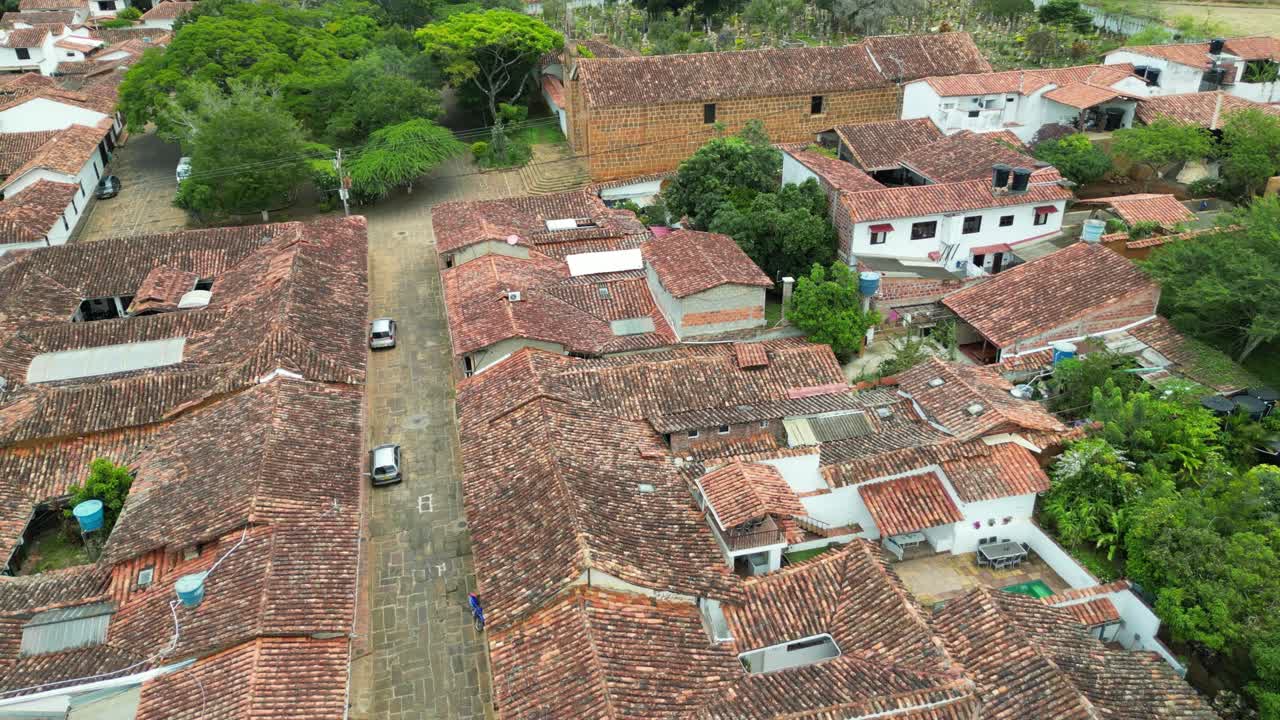 Scenic aerial views of the picturesque Andean village of Barichara in the Santander Department of Colombia, featuring colonial clay houses, red-tiled roofs and cobblestone streets