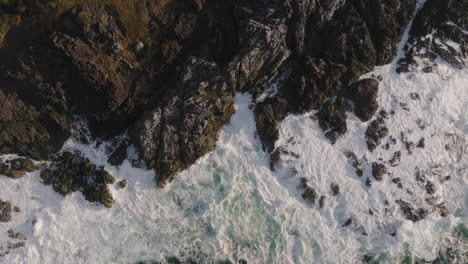 Drone-video-at-sunset-in-Ucluelet-British-Columbia,-Canada-over-the-ocean-and-forest