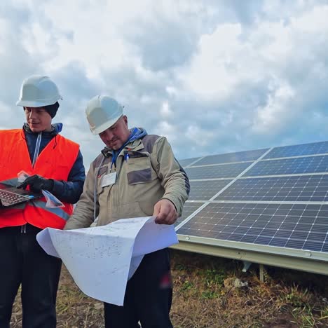 solar farm with two engineers