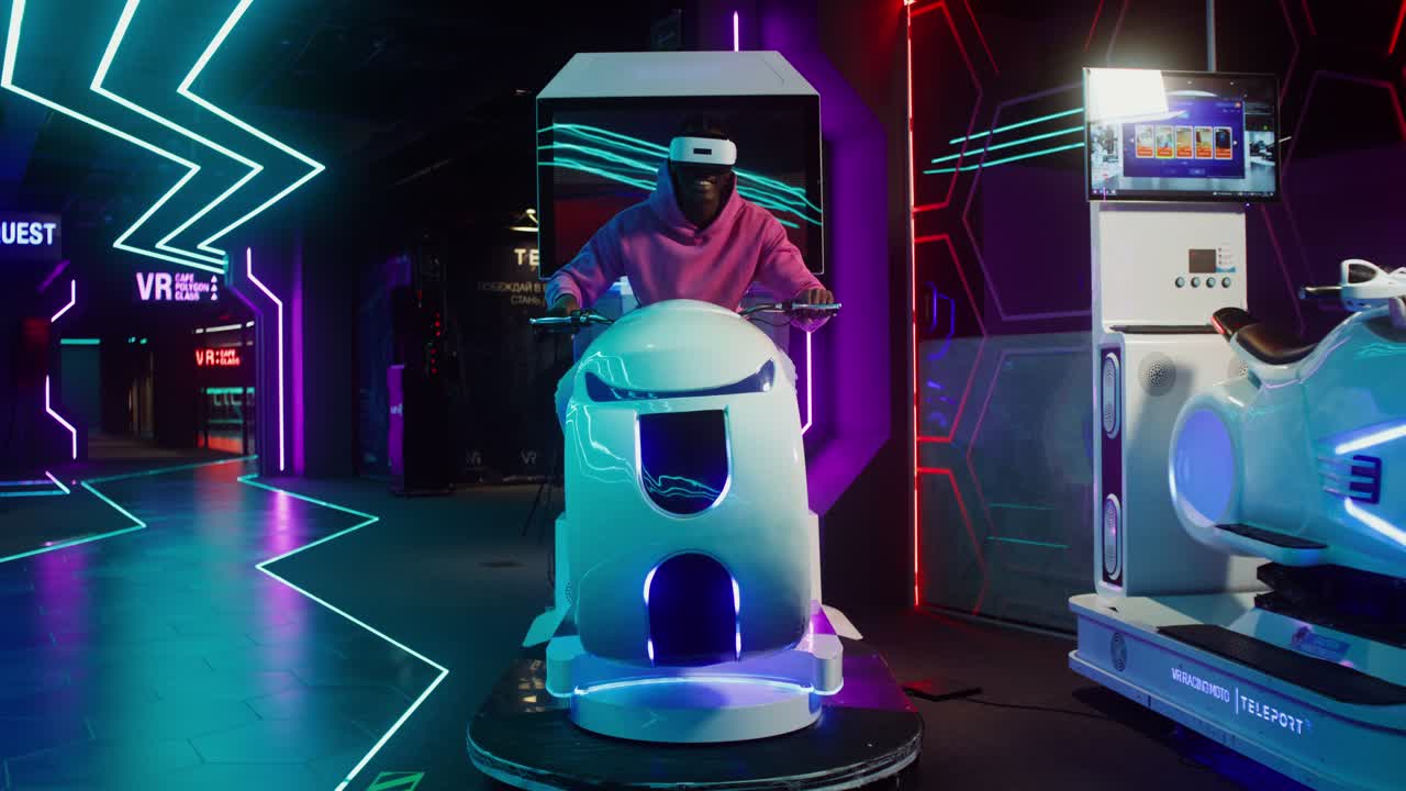 A man riding a VR motorcycle simulator in an arcade