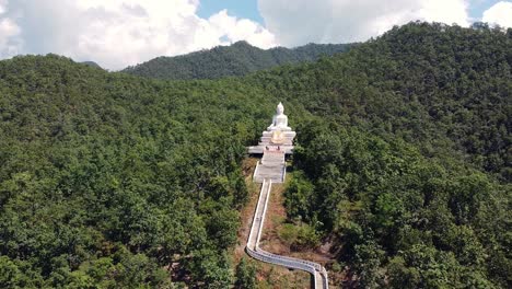 big buddha in pai, thailand zoom out aerial shot