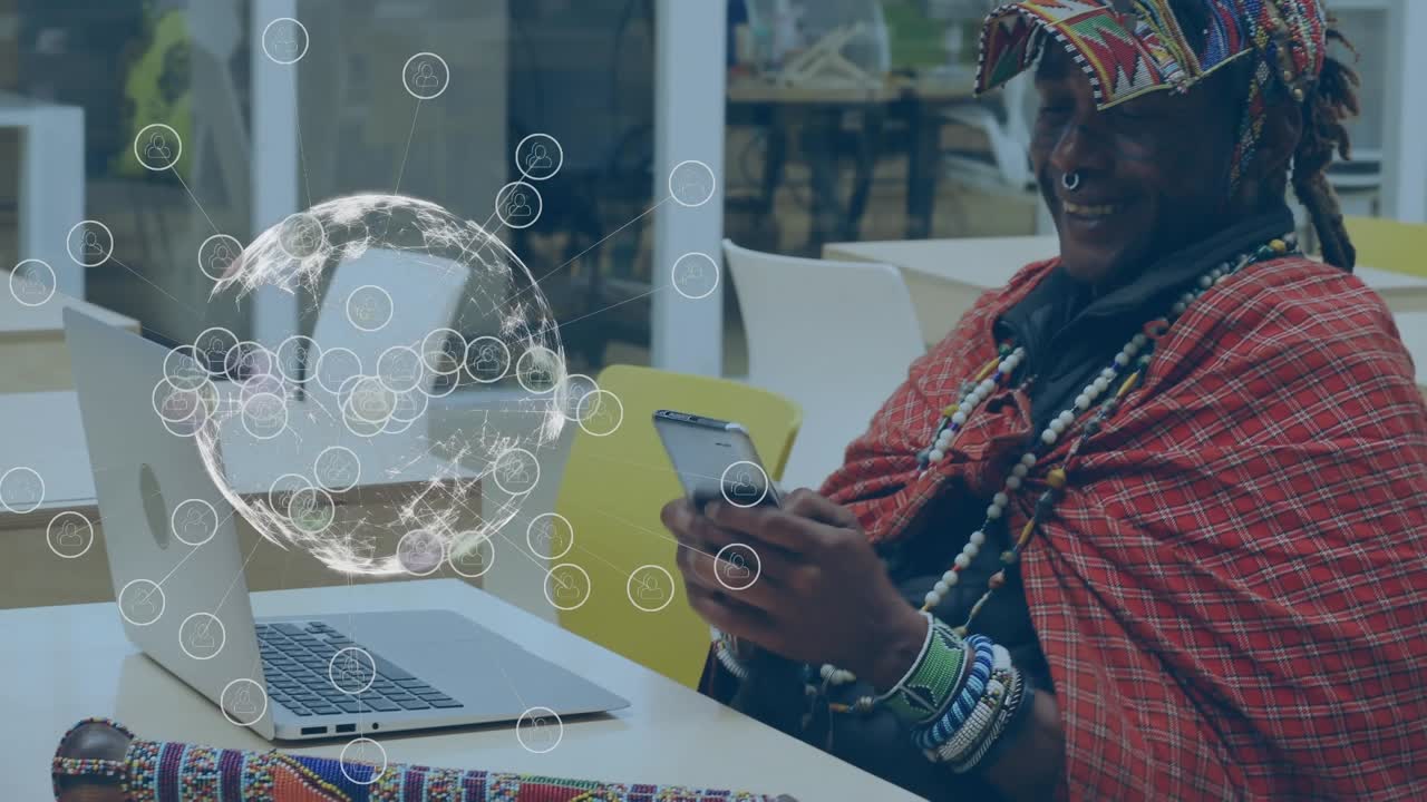 Animation of globe with network over african american man in ethnic clothes using smartphone