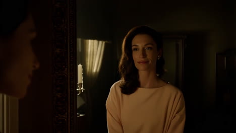 woman looking in a mirror