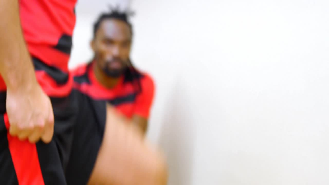 Athletes getting dressed in dressing room 4k