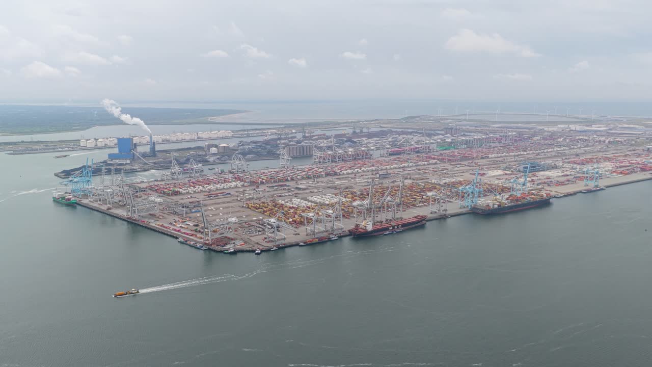 Container vessels at Dutch terminal moving cargo through harbor, Netherlands