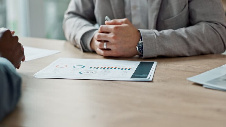 Diverse business people, hands and graphs
