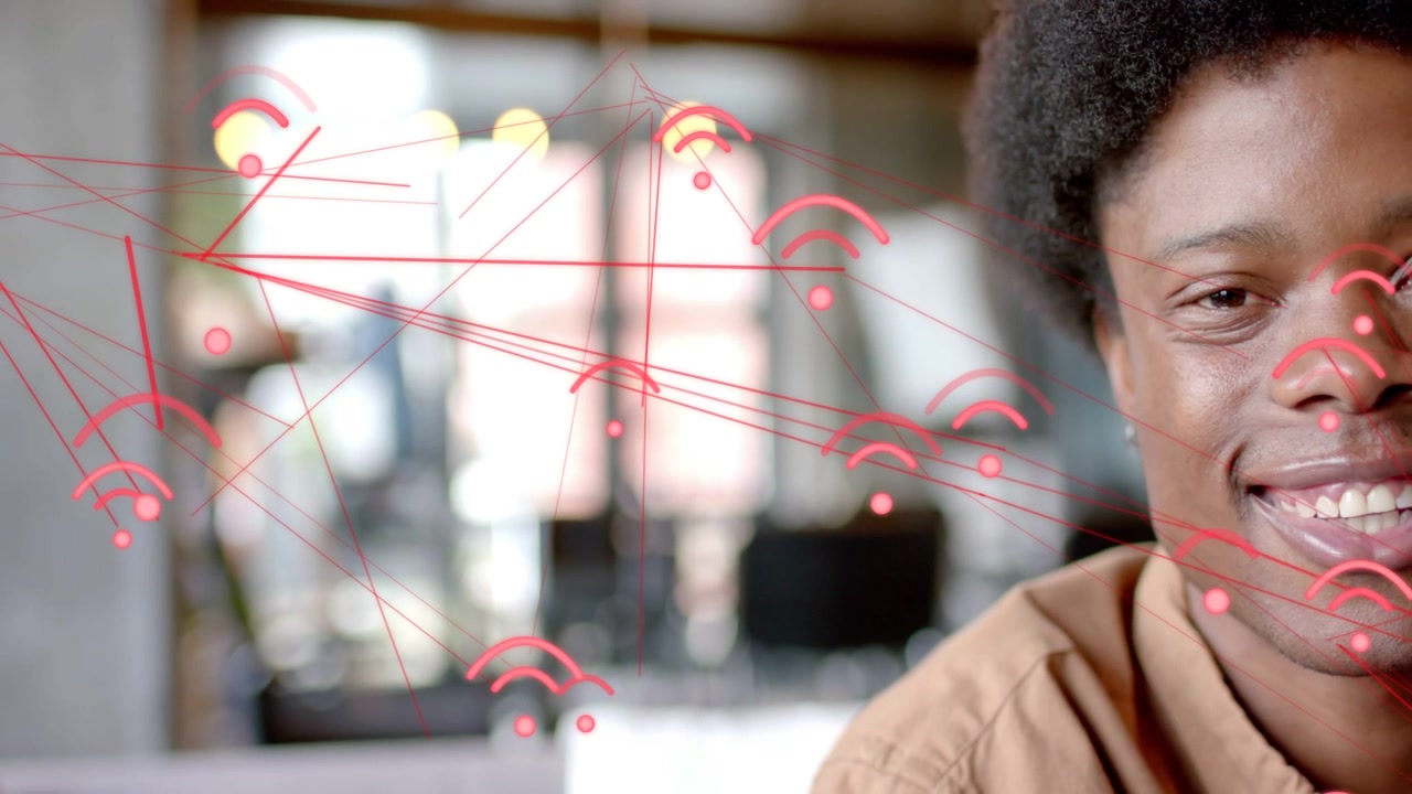 Man reacting to expanding red network graphics showing growing connection, smiling, leaning in tech
