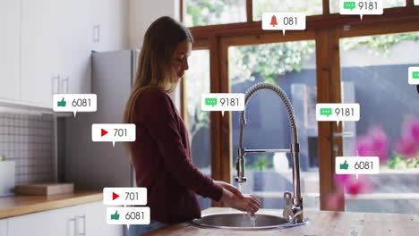 female marketer washing hands under spring-neck faucet, showing floating social media icons