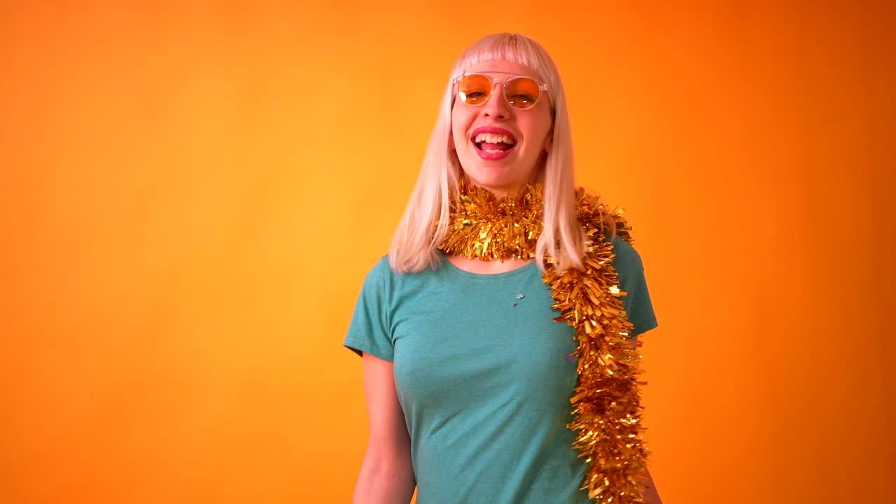 Woman celebrating with confetti and tinsel