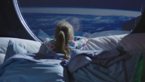 child looking at earth from space bed