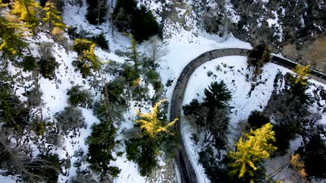 aerial overhead shot over snow capped angeles crest highway