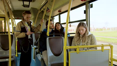 Young-woman-reading-a-book-in-the-bus