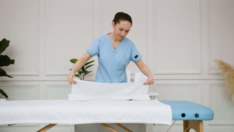 physiotherapist preparing the massage room