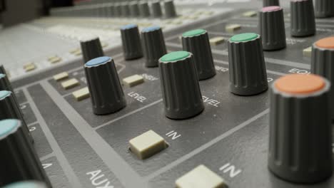 adjusting levels on a sound mixer