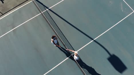 Video-of-top-view-of-diverse-female-tennis-players-on-court