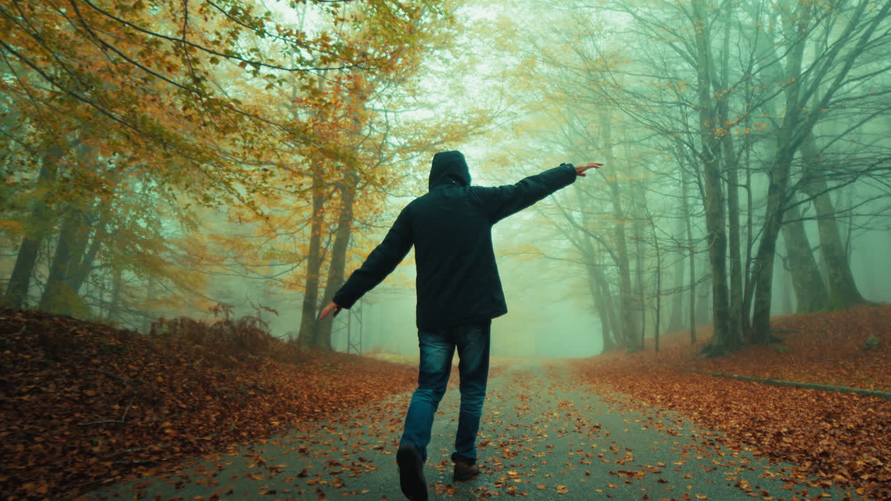 Happiness Of An Old Man Walking With Open Arms Flying In Autumn Fog Mountain