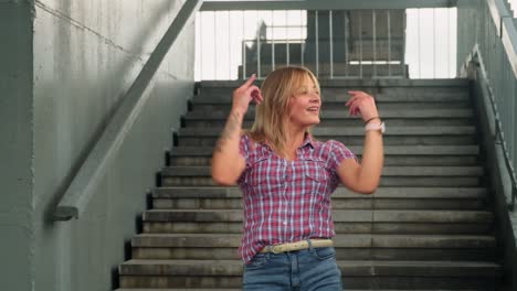 woman dancing on stairs
