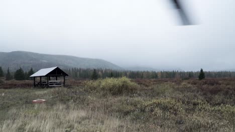 cloudy mountain landscape with cabin