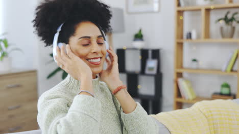 Dance,-relax-and-music-with-woman-on-sofa